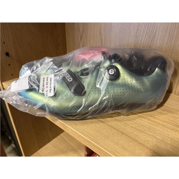 NEW PAIR OF GREEN BIKE SHOES. SIZE 12.5 WITH CLIPS.