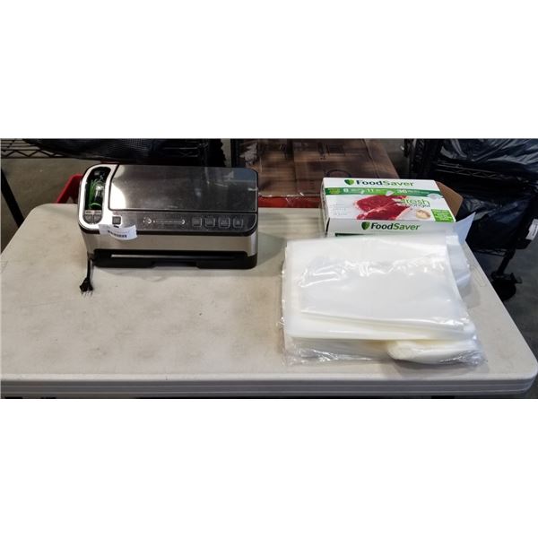 FOOD SAVER WITH VACUUM ATTACHMENT AND BAGS