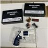 Image 1 : 2 NEW SOFT EJECTION EDUCATIONAL REVOLVER GUNS WITH 2 DIFFERENT SETS OF SHELLS
