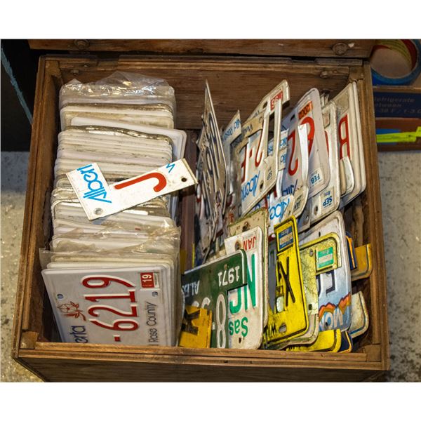 CRATE OF METAL LICENSE PLATES AND PIECES