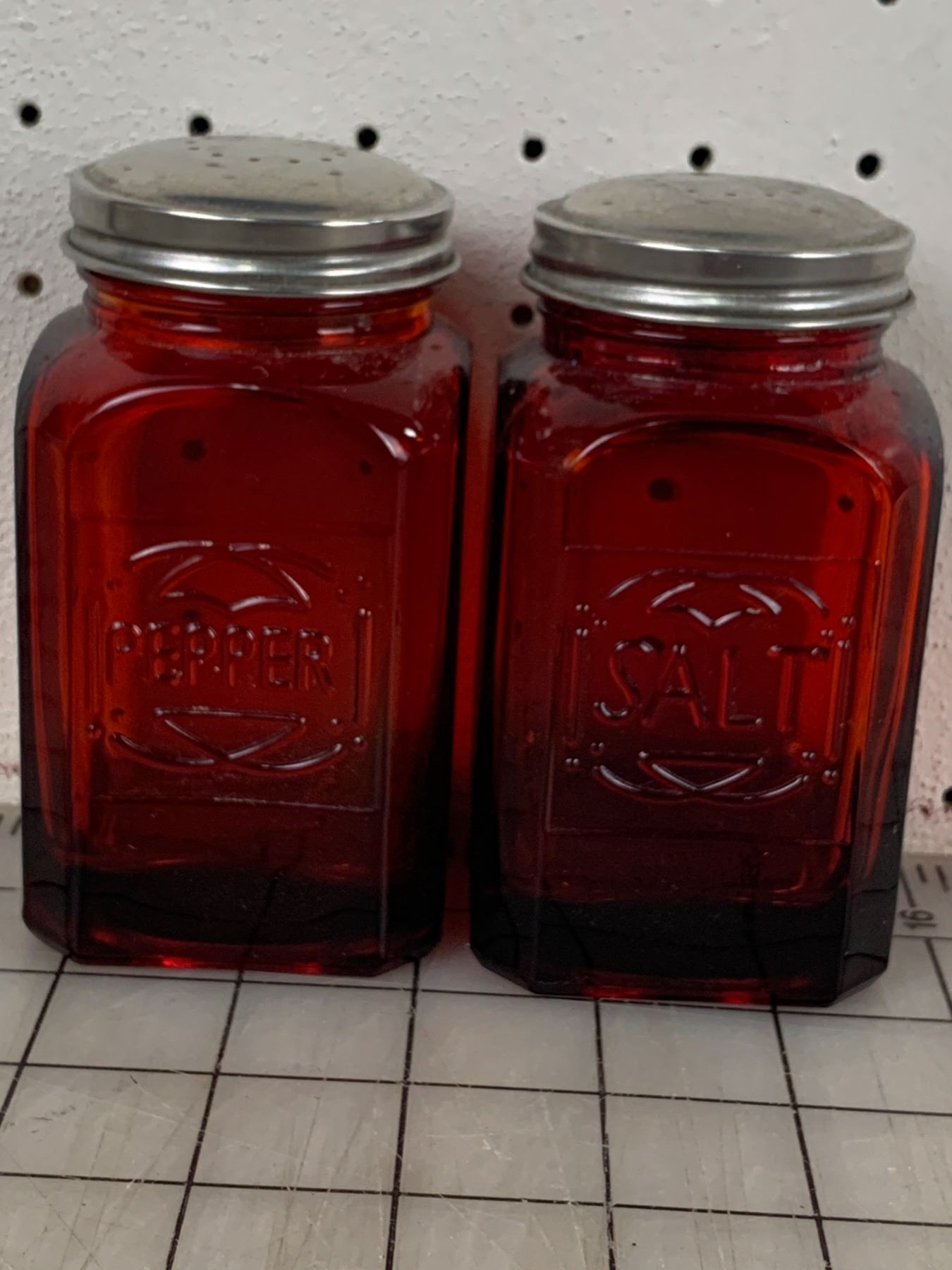 VINTAGE EMBOSSED RUBY RED GLASS SALT AND PEPPER SHAKERS - Schmalz Auctions