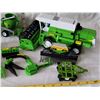 Image 4 : Group of farm equipment toys.