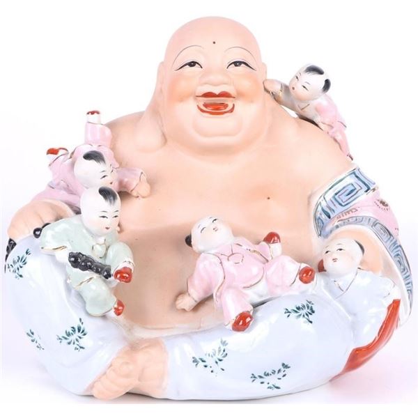 ASIAN PORCELAIN BUDDHIST PLAYING SCULPTURE