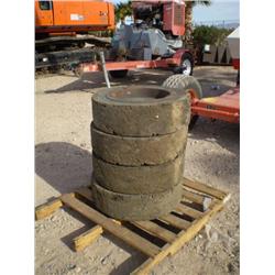 QUANTITY (4) SOLID USED TIRES FOR SKID STEER