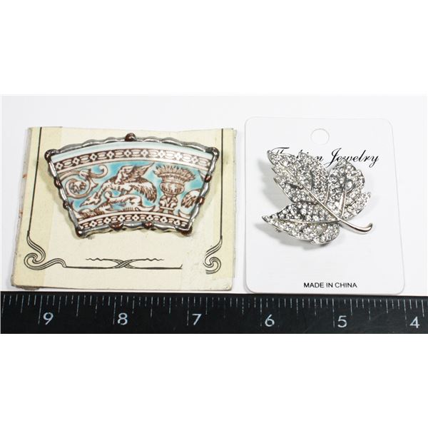 TWO PINS/ BROOCHES. ONE IS RHINESTONE MAPLE LEAF