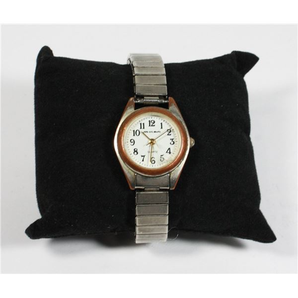 MILAN STRETCH BAND WRIST WATCH. FACE COVER HAS