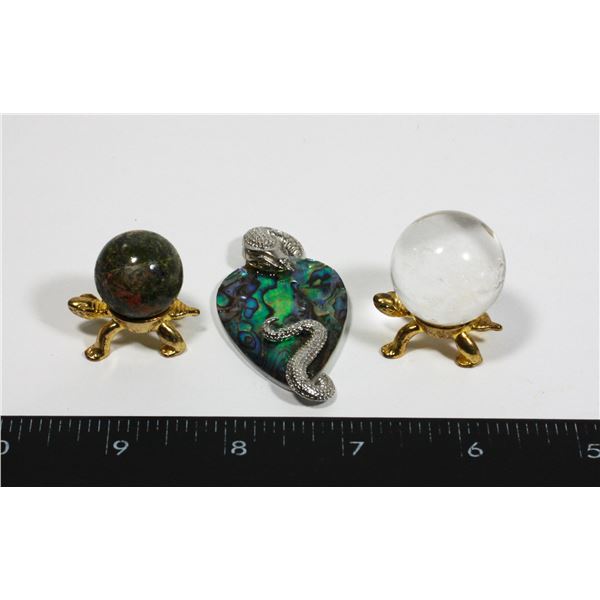 TWO STONE SPHERES ON TURTLES SOLD WITH