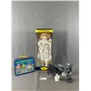 Image 1 : Assorted Collectibles - Porcelain Doll In Box, Pearlite Inuit Carvings & Tin SpongeBob Lunch Kit