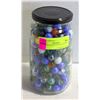 Image 1 : 7" HIGH JAR OF VINTAGE MARBLES