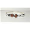 Image 1 : 9)  OPEN ENDED BRACELET WITH ROUND AMBER ON