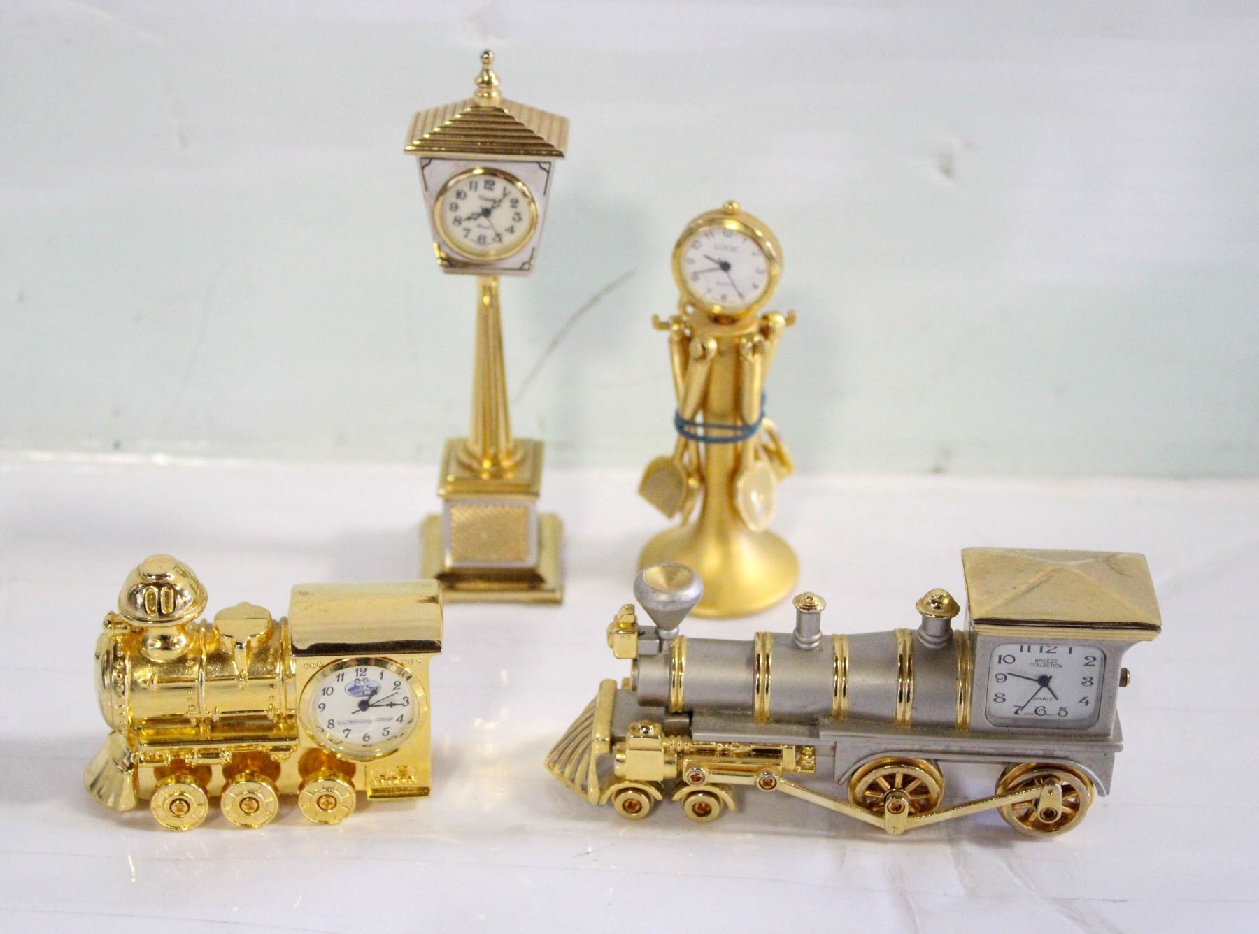 4 VINTAGE MINIATURE BRASS DESK CLOCKS