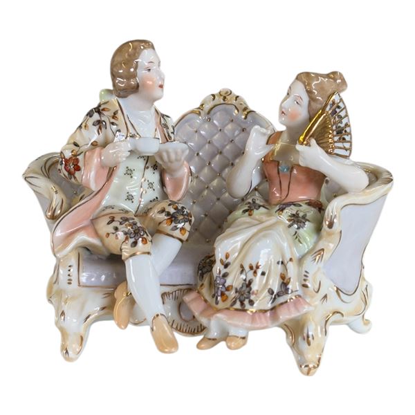 VICTORIAN COUPLE ON CHAISE FIGURE
