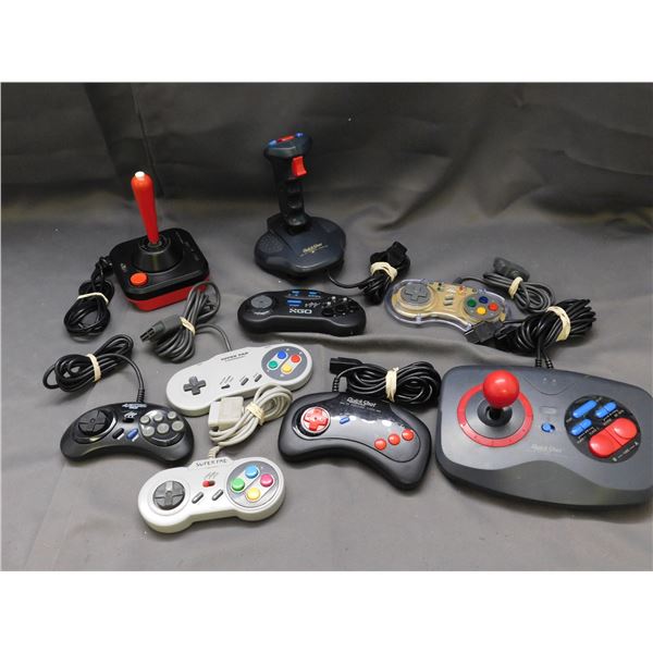 Lot of 9 Vintage Atari, SNES  & SEGA Controllers *all as is untested*