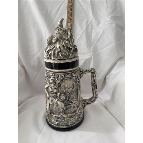 large, detailed beer stein with a lid, featuring a Viking and wizard fantasy theme