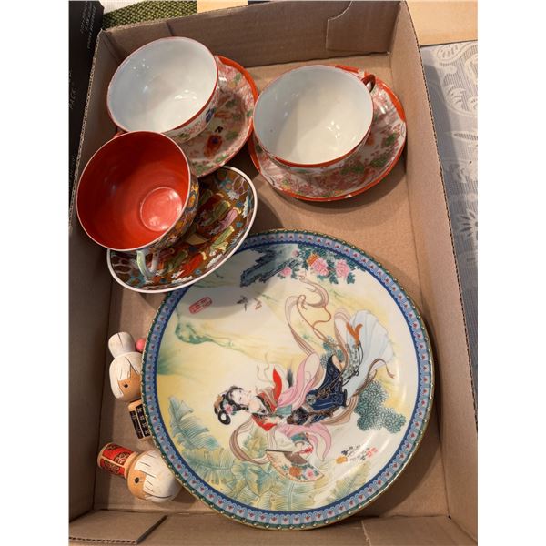 Asian themed cups and saucers and plate