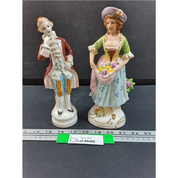 (2) Porcelain Woman w/Garden Flowers & Man Figurines - 8.5" Tall