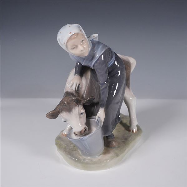 Royal Copenhagen Porcelain Figurine, Girl Feeding Calf