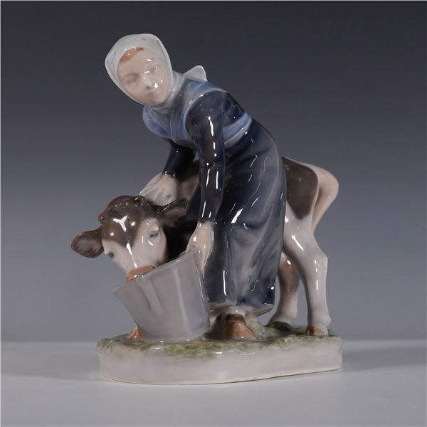 Royal Copenhagen Porcelain Figurine, Girl Feeding Calf 779