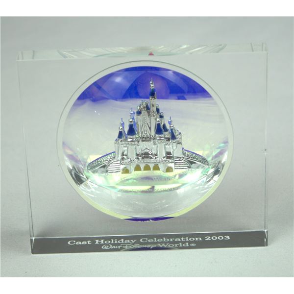 A 2003 Holiday Celebration Glass Paperweight.