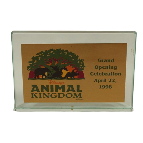 An Animal Kingdom Grand Opening Celebration Glass paperweight.