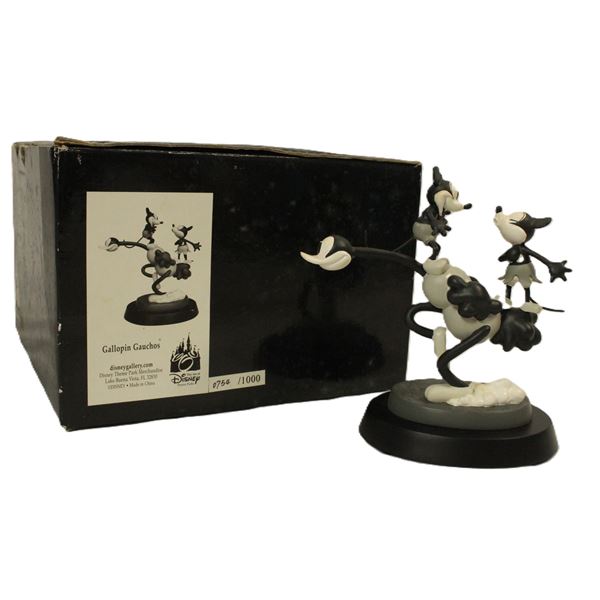 A Mickey and Minnie Vintage Figurine.