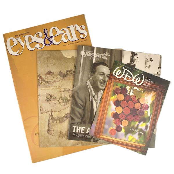 A Mix of Four (4) Eyes and Ears and Walt Disney World Cast Magazine.