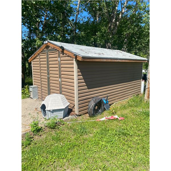 Approx. 10 ft. x 14 ft. storage shed c/w wood floor, Buyer responsible to move