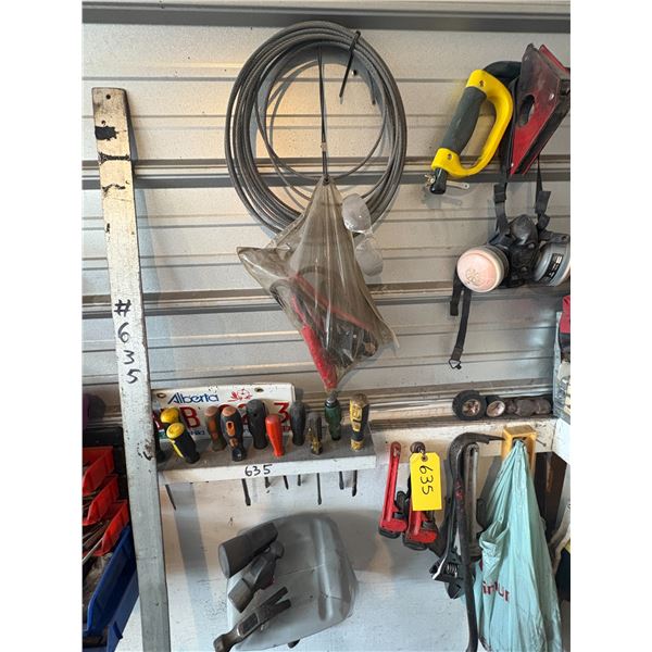 Contents on wall- screwdrivers, pipe wrenches, hammers, magnet, cable, slow moving sign & misc.