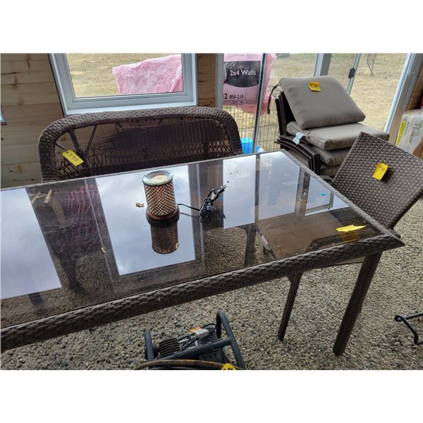 Glass top picnic table c/w 4- wicker chairs, wicker bench (has damage) & cushions etc.