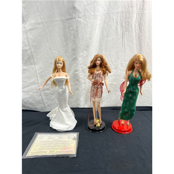 3 Barbies With Stands
