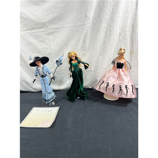 3 Assorted Barbies With Stands