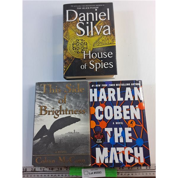 (3) Various Books by Daniel Silva, Colum McCann and Harlan Coben
