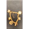 Image 1 : 18K CHARM BRACELET WITH ASSORTED 14K AND SILVER CHARMS (21.1G)