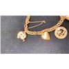 Image 2 : 18K CHARM BRACELET WITH ASSORTED 14K AND SILVER CHARMS (21.1G)