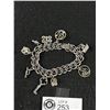 Image 2 : Vintage Sterling Silver Charm Bracelet with 9 Charms