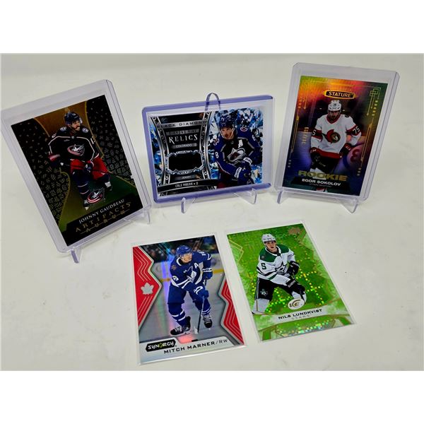 High-End Hockey Card Lot Featuring Relics and Limited Rookies