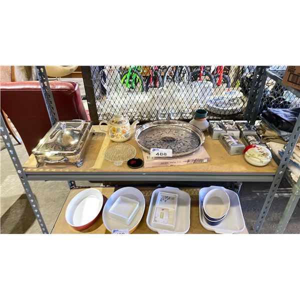 SHELF OF ASSORTED ITEMS INCLUDING; SILVER PLATED NAPKIN RINGS, SILVER PLATED CASSEROLE DISH,