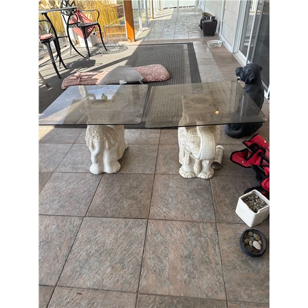 Elephant side tables one piece of glass has chip. See picture.