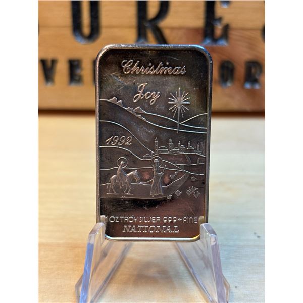 Lot 6-1) 1 oz Christmas Joy 1992 silver bar