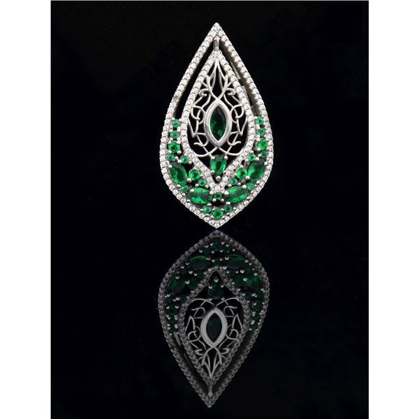 WHITE GOLD, EMERALD AND DIAMOND RING.