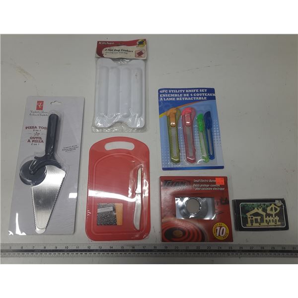 Lot of Misc. Items . (Pizza Cutter, Small Chooping  Board, Cutter, Small Electric Burner Liners, Etc