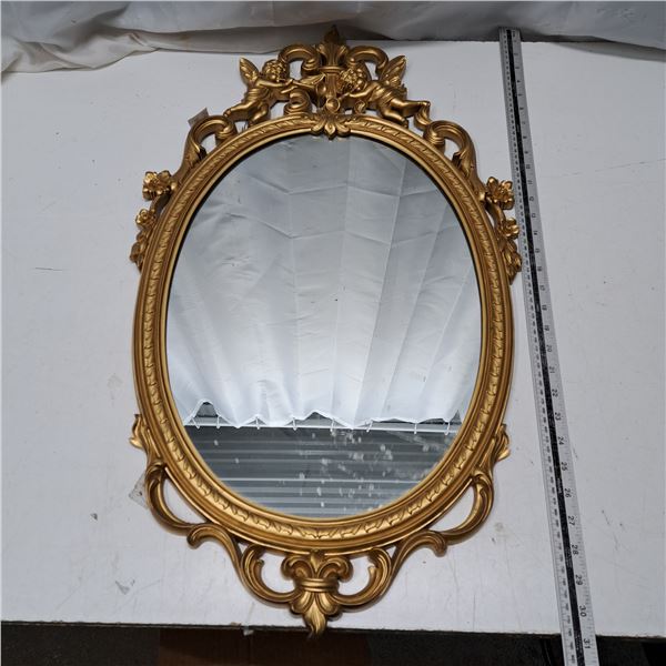 mirror with plastic shell and gold look finish