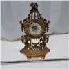 Image 1 : metal clock, the clock is loose