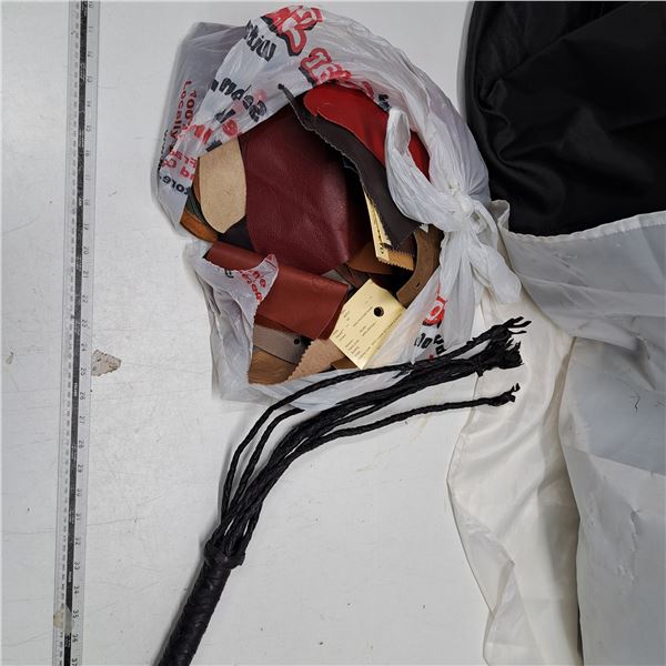bag of various leather patches and leather whip