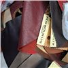 Image 2 : bag of various leather patches and leather whip