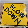 Image 1 : slow down sign