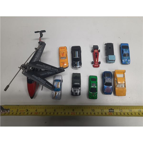 (10) Vintage Toys Cars and (1) Helicopter.