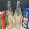 Image 4 : 2 glass coke bottles and 2 coca cola tins