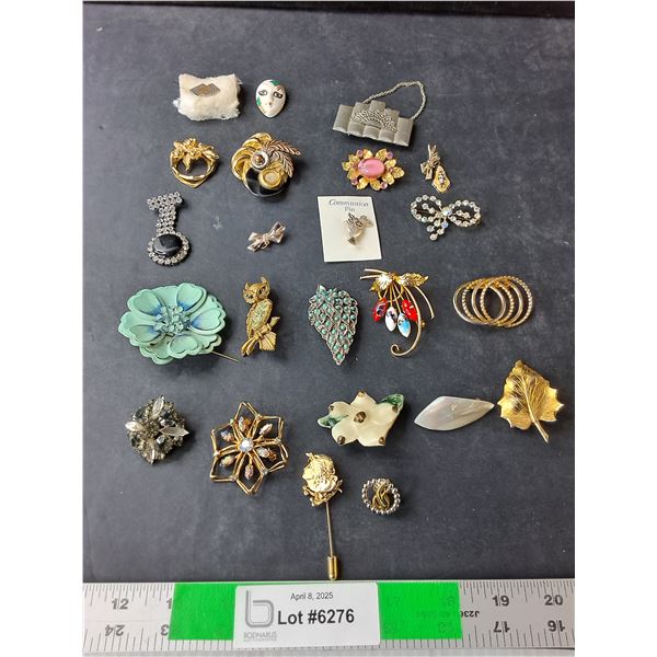 (23) Brooches