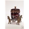 Image 1 : Ruby flash cut to clear biscuit barrel and three cherub bronze base, 10" in height